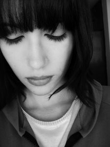 black and white pic of a woman looking down