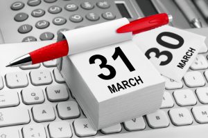 calendar with march 31 as the date and a pen clipped on it