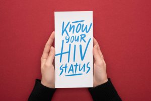 know your HIV status written on a piece of paper