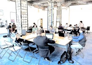 employees sitting at desks in an office 