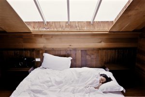 woman sleeping in a big bed
