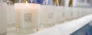 candles with the words "love heals every body"