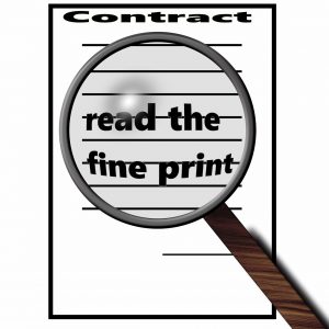 contract with a magnifying glass over it that says read the fine print