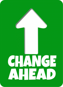 change ahead sign in green and white with an arrow pointing upward