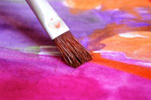 paintbrush on a painted canvas