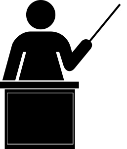 silhouette of a person at a stand holding a stick