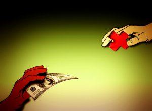 hand with money in it and another hand with a red cross in it