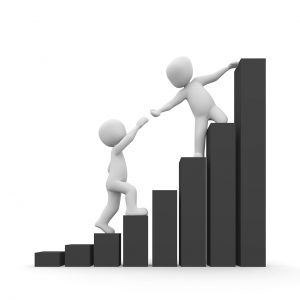 person at the top of a bar graph grabbing the hand of someone below and helping them up