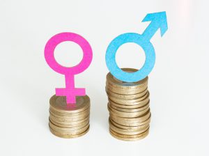 2 rows of coins, one smaller with a pink woman gender sign and the other larger with a blue male gender sign