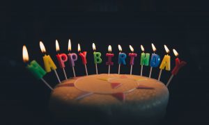 happy birthday candles on a cake