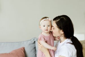 caucasian woman holding a baby