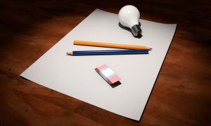 paper with a light bulb on it, a pencil and eraser