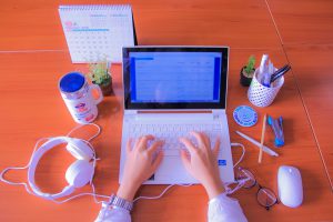 hands on a laptop keyboard