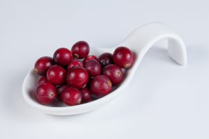 cranberries on a white spoon