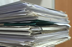 files and papers stacked on top of each other
