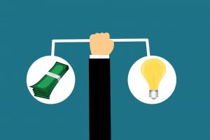 illustration of a hand holding a bar with a lightbulb on one end and money on the other