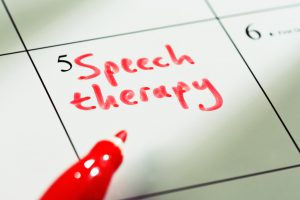 speech therapy written in red marker in a calendar day