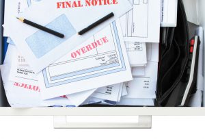 overdue bills stacked on top of each other