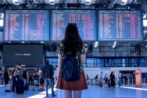 back of a woman standing in an airport