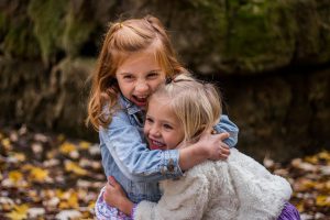 two young girls hugging