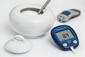 diabetes machine with sugar next to it