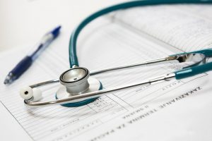 stethoscope on top of paperwork