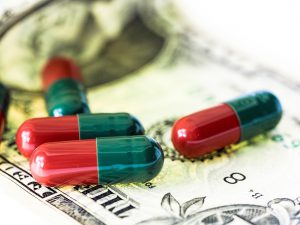 medicine sitting on top of money