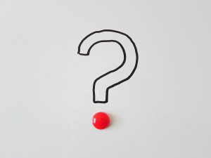 question mark with a red dot