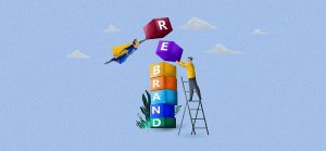 rebrand being written in blocks by 2 people