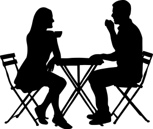 silhouette of 2 people sitting down from each other