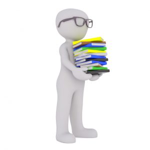 silhouette of a man holding books with glasses on