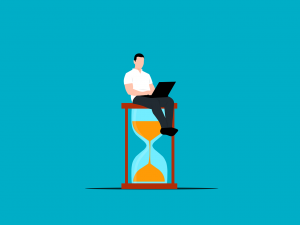 illustration of a man with a laptop sitting on an hourglass