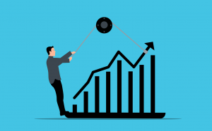 illustration of person using a pulley to guide an arrow on a graph upwards