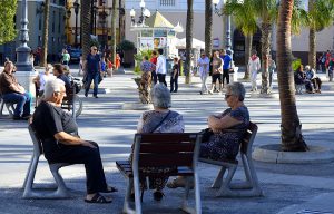 older adults sitting together outside