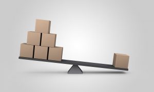 scale with many boxes on one side and one box heavier on the other side