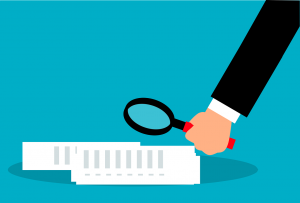 illustration of a hand looking at paperwork