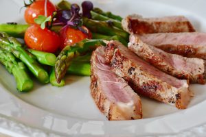 dinner plate of pork and vegetables