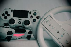 video game controllers next to each other