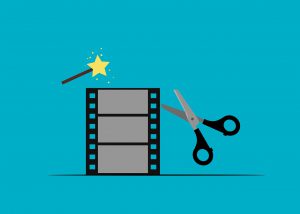 scissors and wand next to video clip