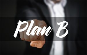 person pressing the words Plan B 