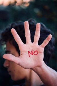 hand with the word no on it