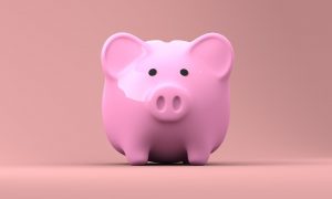 pink piggy bank on a light pink background